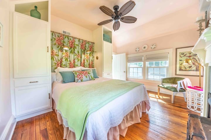 Comfy queen bedroom filled with original detail and the most gorgeous light.  Views of greenery outside are reflected in the fabric which was also used at the famous Greenbrier resort.