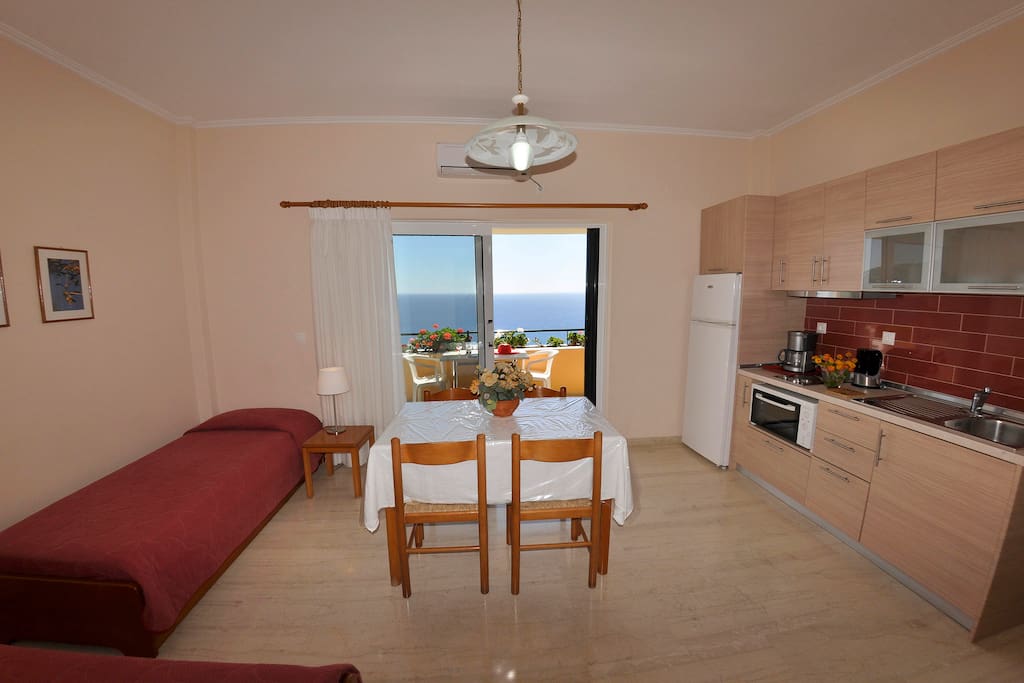 Kitchen area and 2 single beds