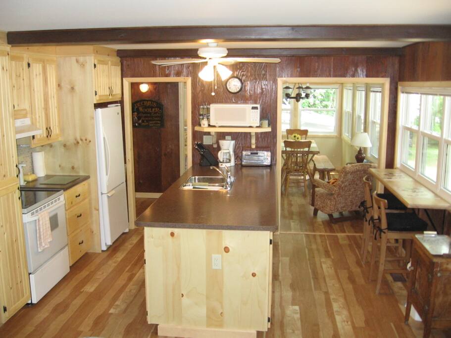 A large kitchen & dining area with lake views