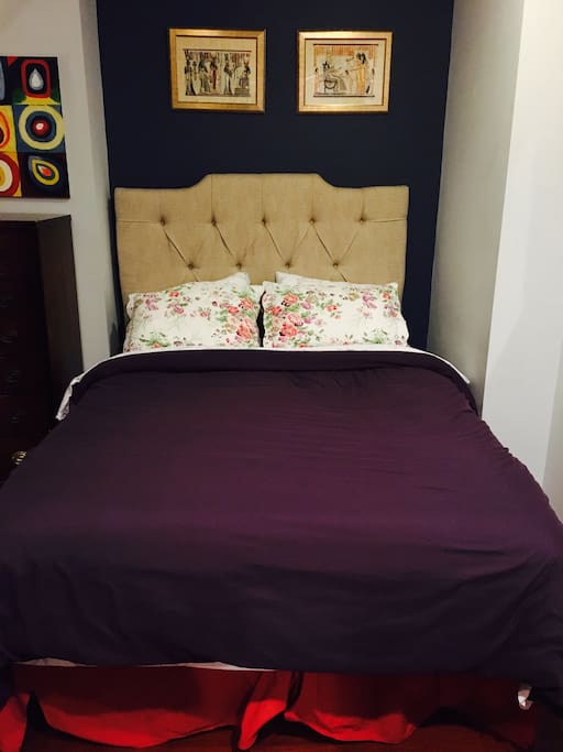 New queen-sized pillow top bed with luxury linens and microfiber down comforter.