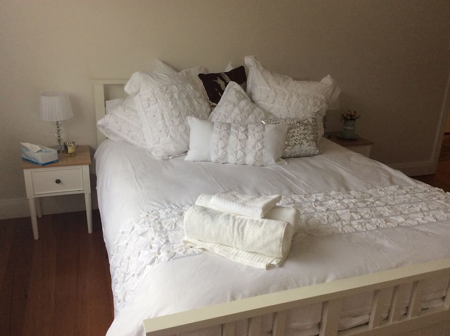 Queen size bed with quality linen