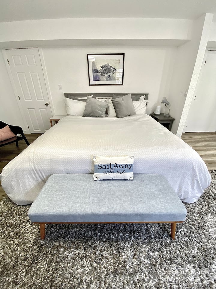 Platform king with extra nice pillows and Duvet ensure A great night sleep and a bed that you won't want to get out of.  Bed ide table with built in USB  ports to charge phone and accessories.