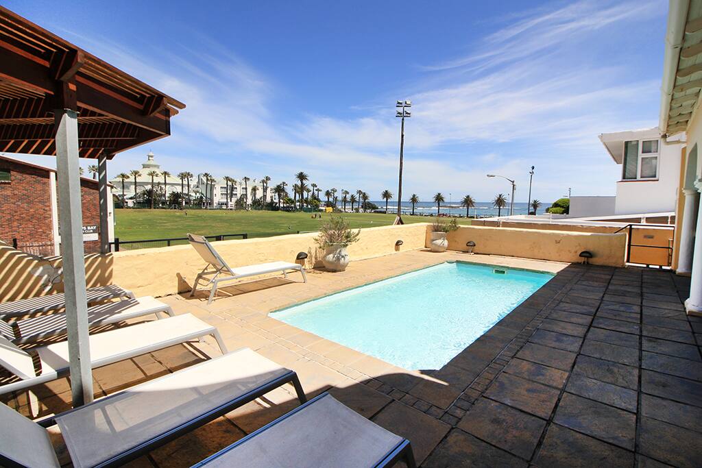 Communal pool area with loungers