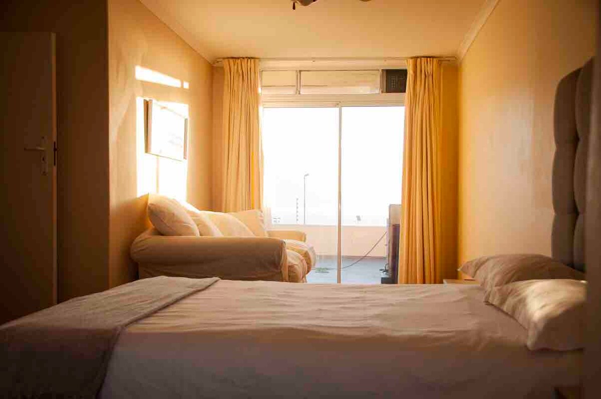 Bedroom 2  
En suite with views and access the pool. Views to the sea and Table Mountain. Includes comfortable sofa. 