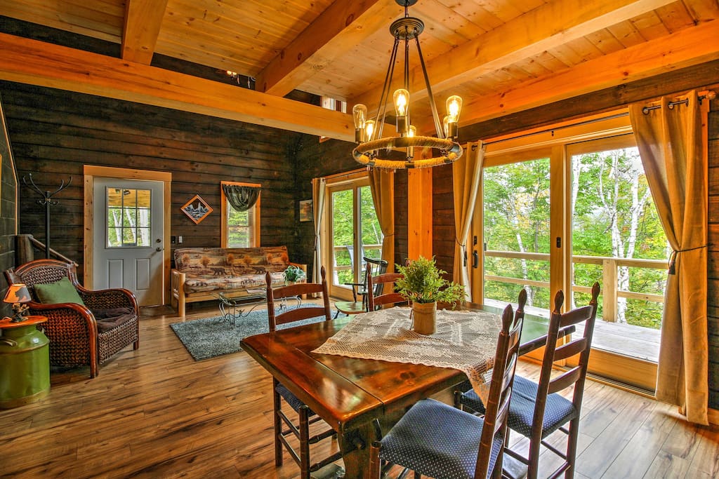 Comfortable furnishings and rustic decor flow throughout the cabin.