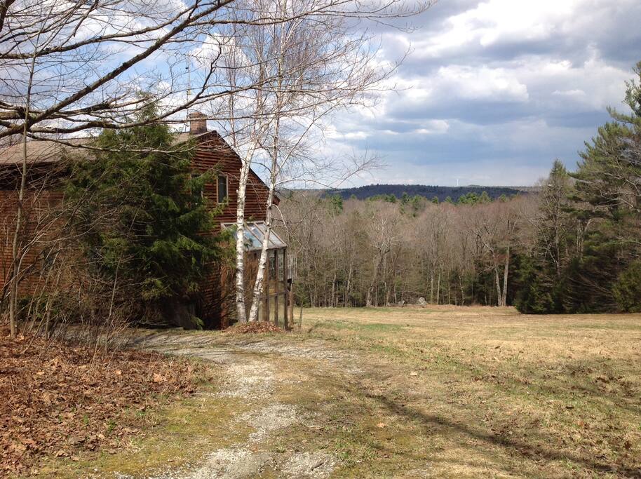 House from driveway entrance showing Berkshire hills in the back.