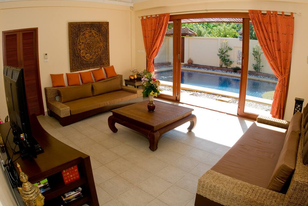 LIVINGROOM LOOKING OUT TO THE POOL