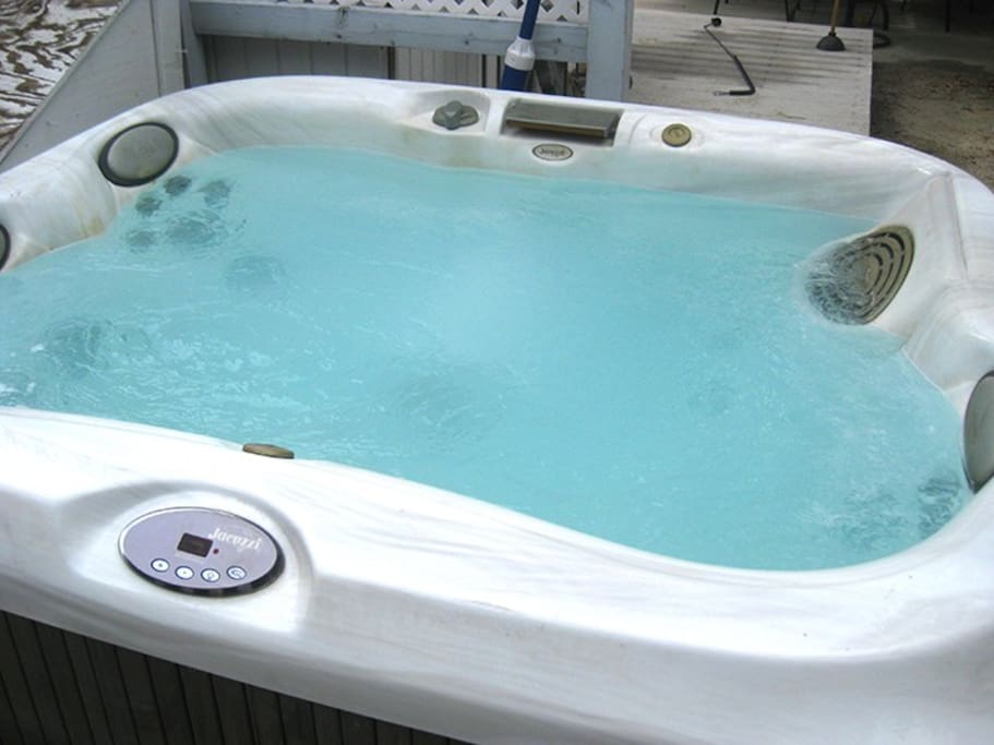 Heated jacuzzi in backyard