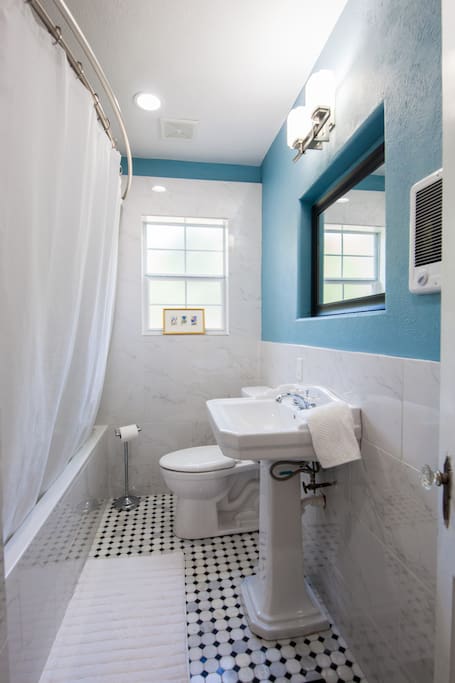 Fully renovated bathroom
with marble tile and huge tub