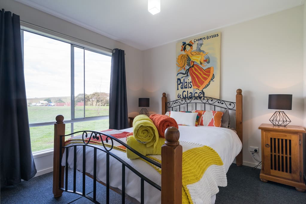 Enjoy a calm and relaxing bedroom that overlooks 8.5 acres