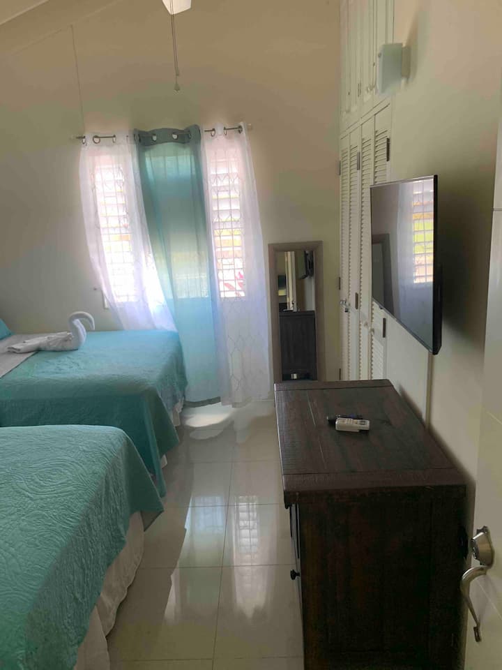 Third bedroom with two full-size beds, private bath and a/c