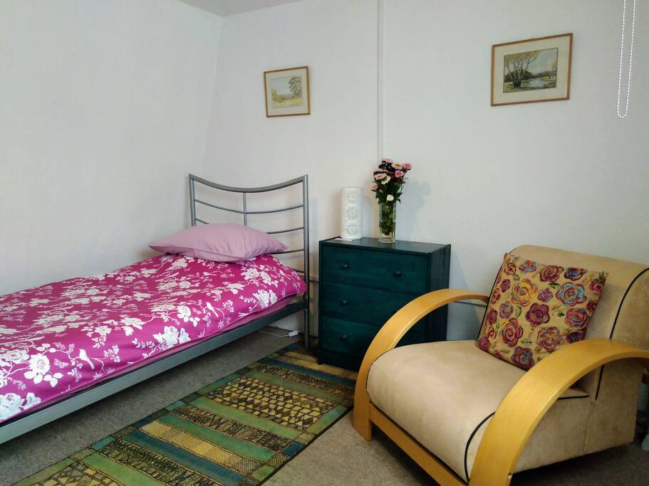 Cosy room in the roof top with a view of the rear terrace and Downing College gardens