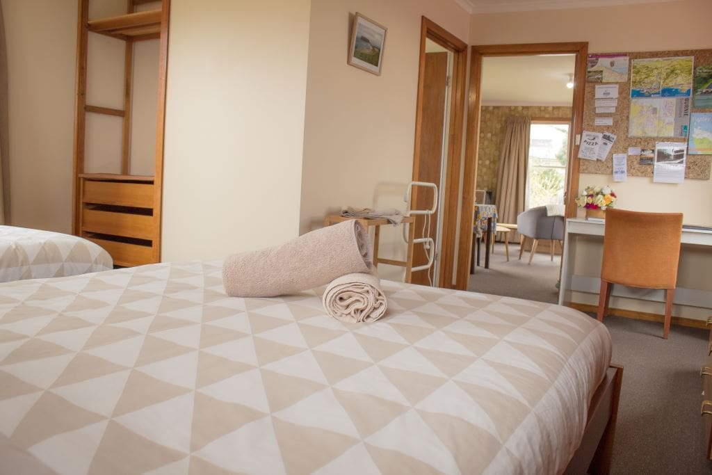 Your own spacious area with two rooms, a bedroom with 1 x queen size and 1 x single bed and separate lounge/dining area.
