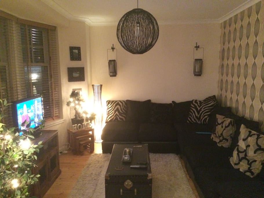 The living room has a 7 seater sofa, perfect for guests to sleep over.