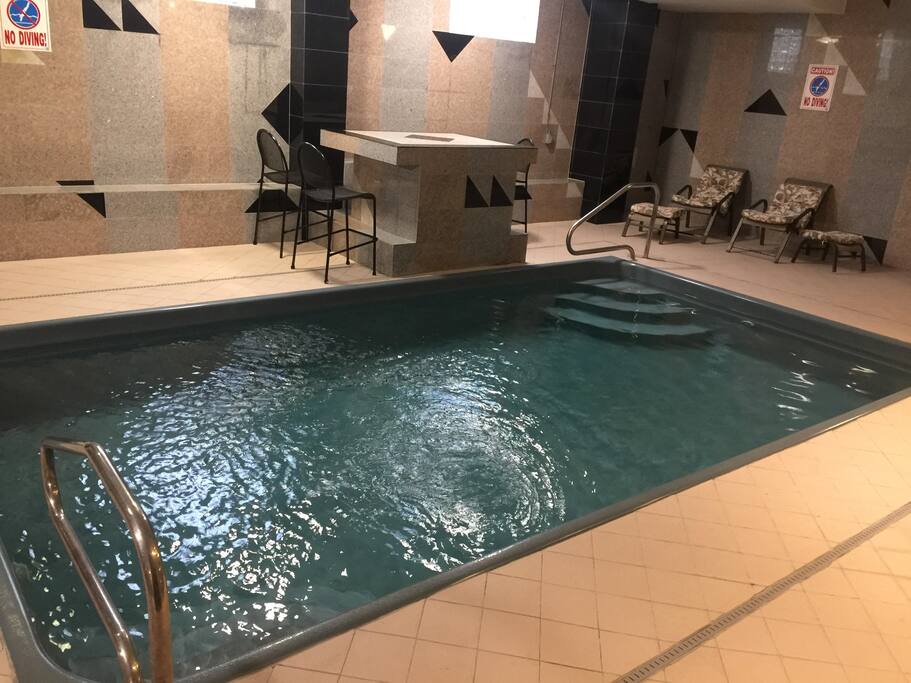 Both pool and jacuzzi open 24 hours. Contains salt water instead of chlorine; much better for the skin!