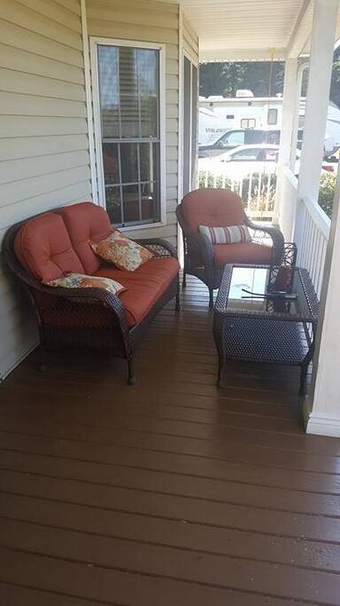 Front porch offers beautiful views. Great for morning coffee.