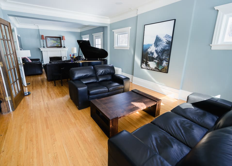 Living room complete with grand piano.