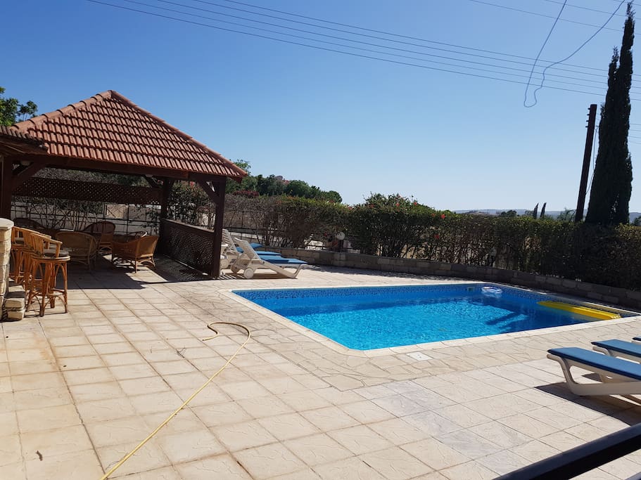 The pool has a covered area, barbecue, small bar, music system, sun beds and umbrellas