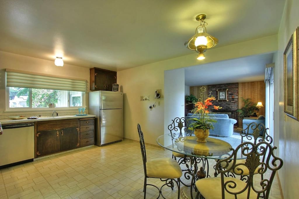Kitchen and dining place, family room in background
