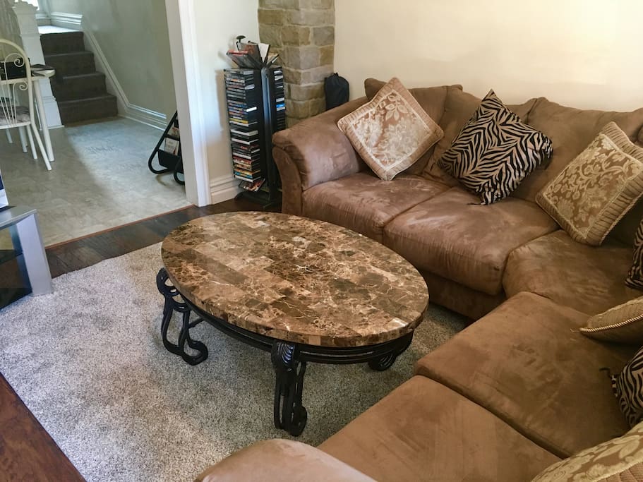 Main Livingroom overlooking Dining room. Sectional fibre sofa seating of 6.