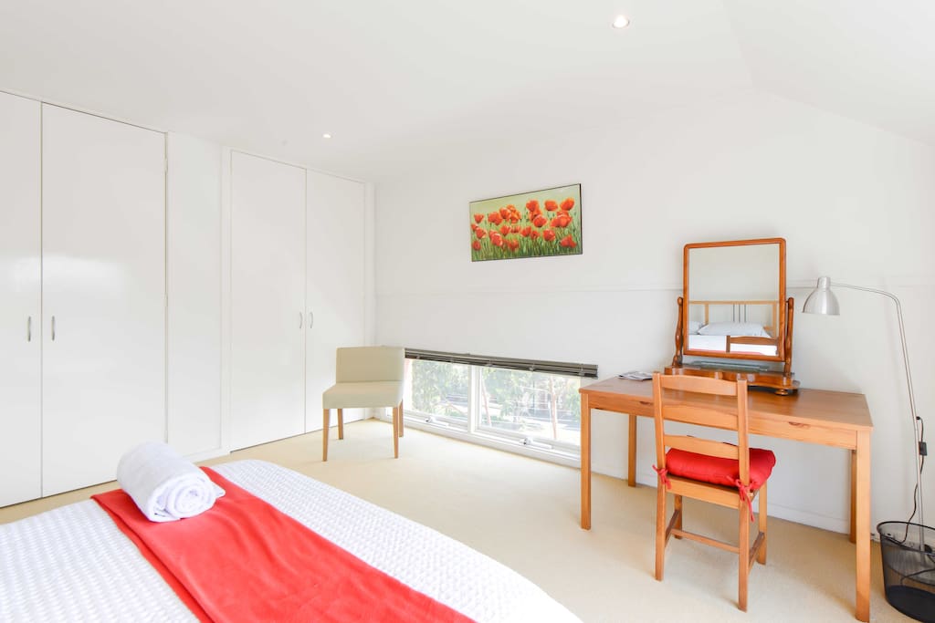 Master bedroom with private bathroom and city views