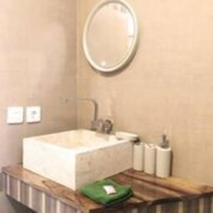 Cozy private bathroom with hot water and shower