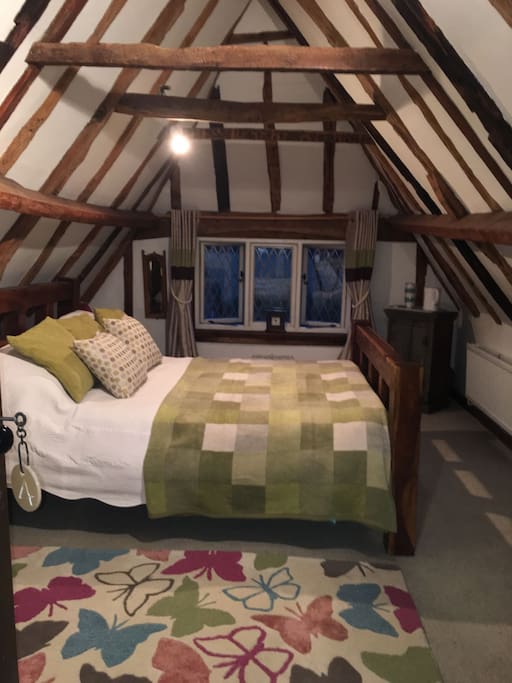 Beautiful king size bed in large double room