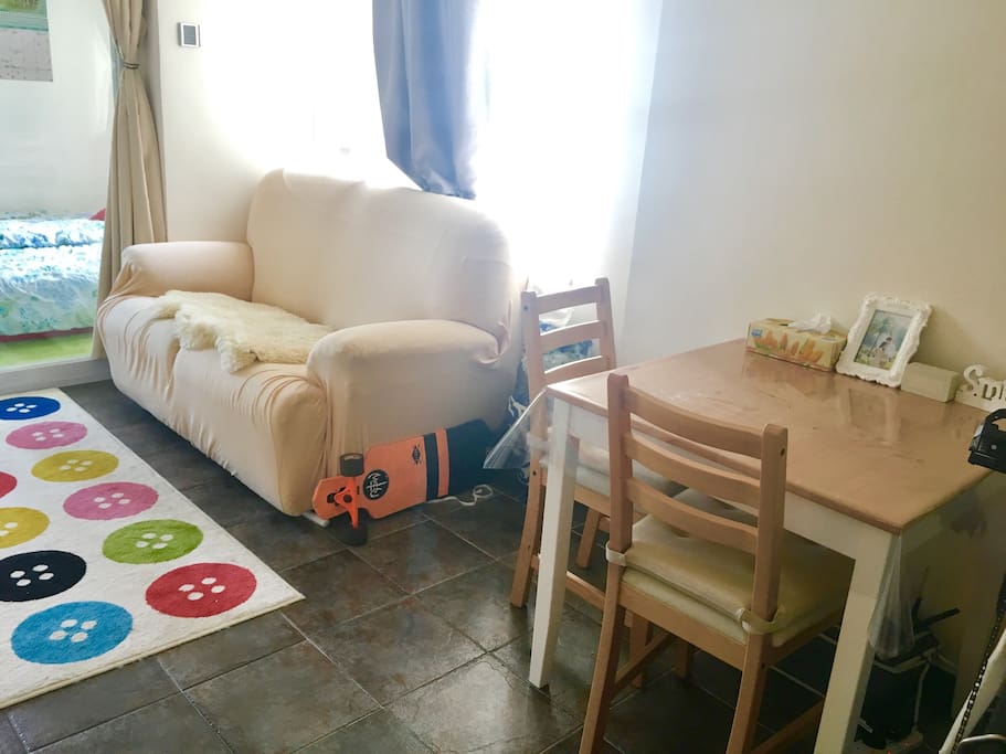 Our homey and tidy living room. You can extend the sofa end to rest your legs after touring around Hong Kong :)