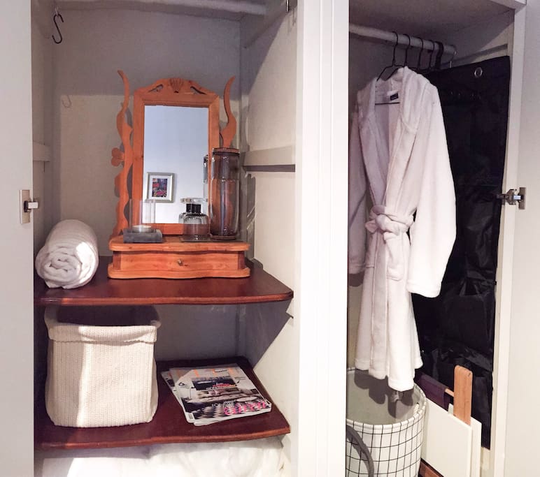 Private wardrobe space. Bathrobe, slippers.