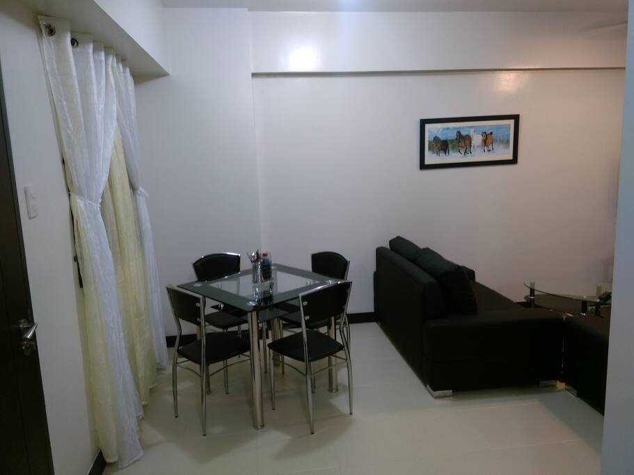 Dining area view from kitchen another table and 2 chairs is available on balcony
