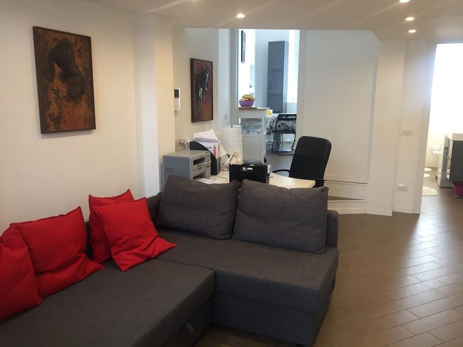 Living room, view to the kitchen and bathroom