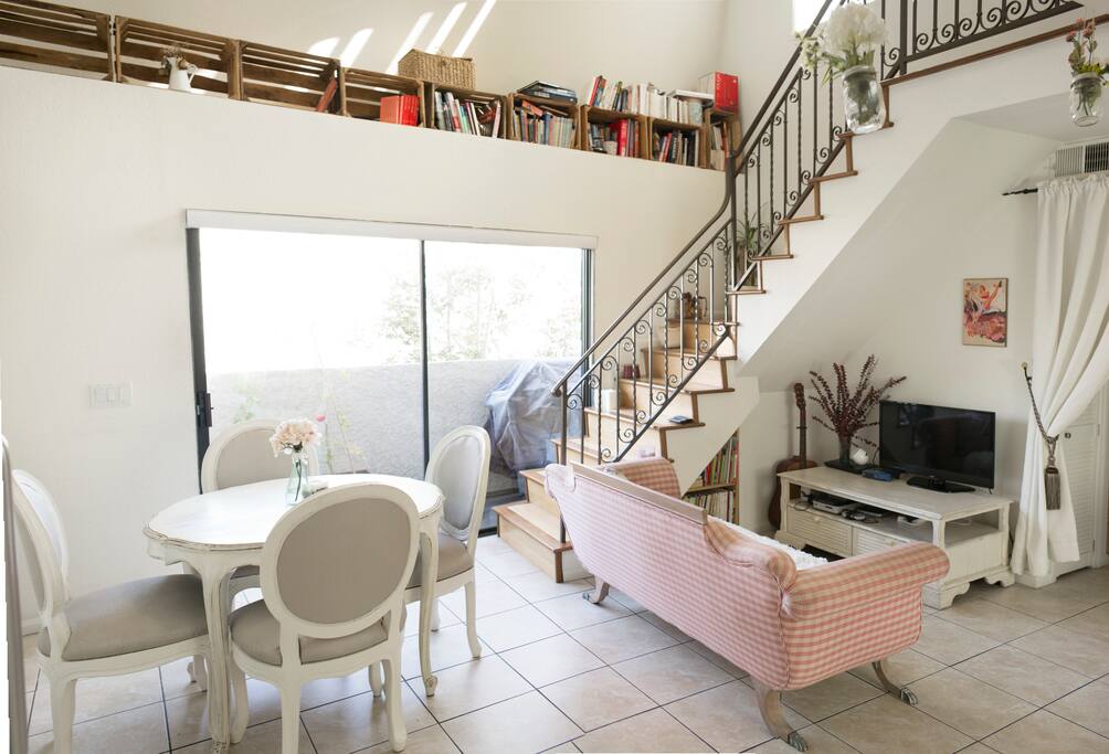 Enjoy our bright living room and its large window to our balcony.