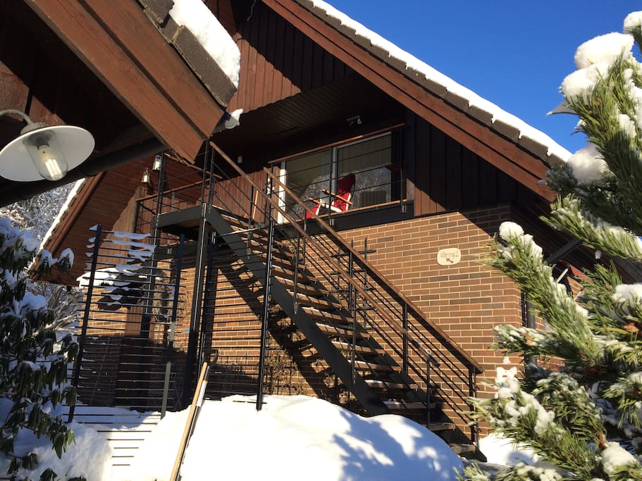 Entrance from the outdoor stairs/balcony via glass slide door.