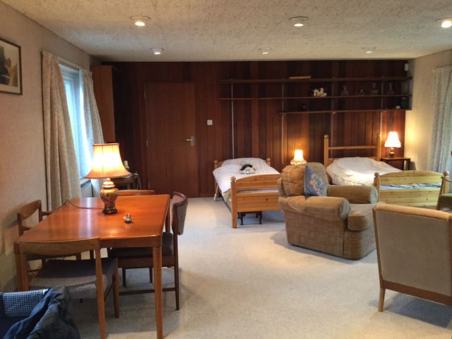 Originally a "granny flat" attached to the main house via a locked door.
Access is at ground floor with step free access. Staircase and/or lift leading to a first floor large bed sitting room comprising 2 single beds, wardrobe, TV, plenty of drawer space. Large windows overlooking garden. Entire flat is wheelchair friendly. Travel cot and high chair available on request, some toys too.