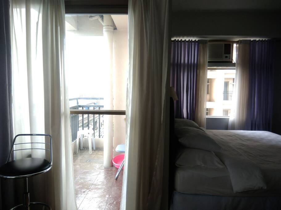 Bedroom with balcony facing the light rail transit line and aurora boulevard