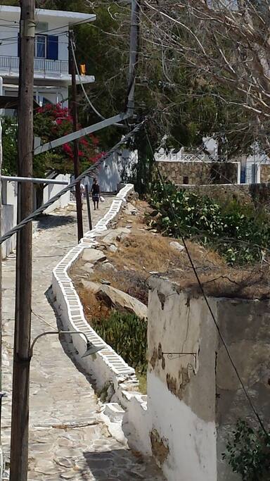 Balcony view. Traditional cycladitic step road. Ten minutes walking lead to main village. Connects Port with Chora (main village).