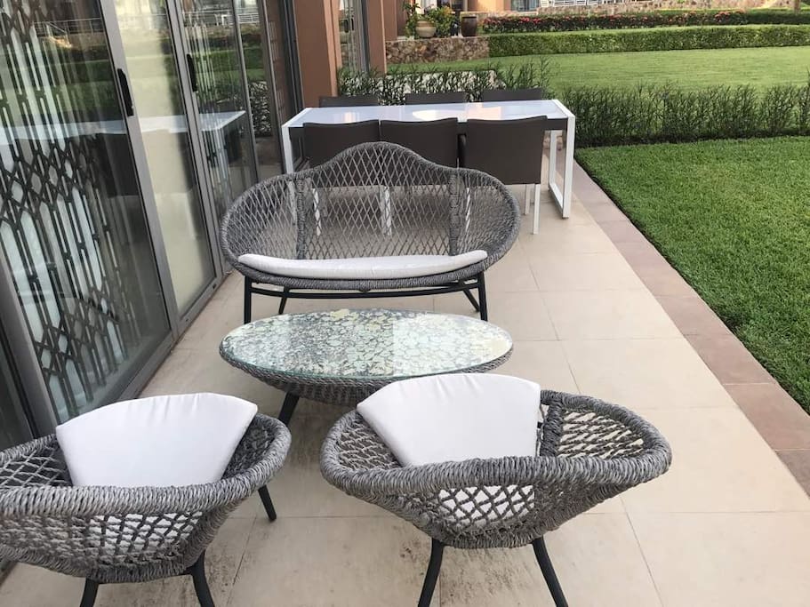Outdoor sitting area with a view of the hotel