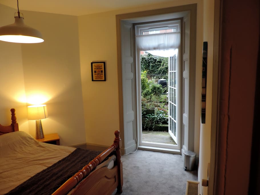 Bedroom-2 with access to the rear garden