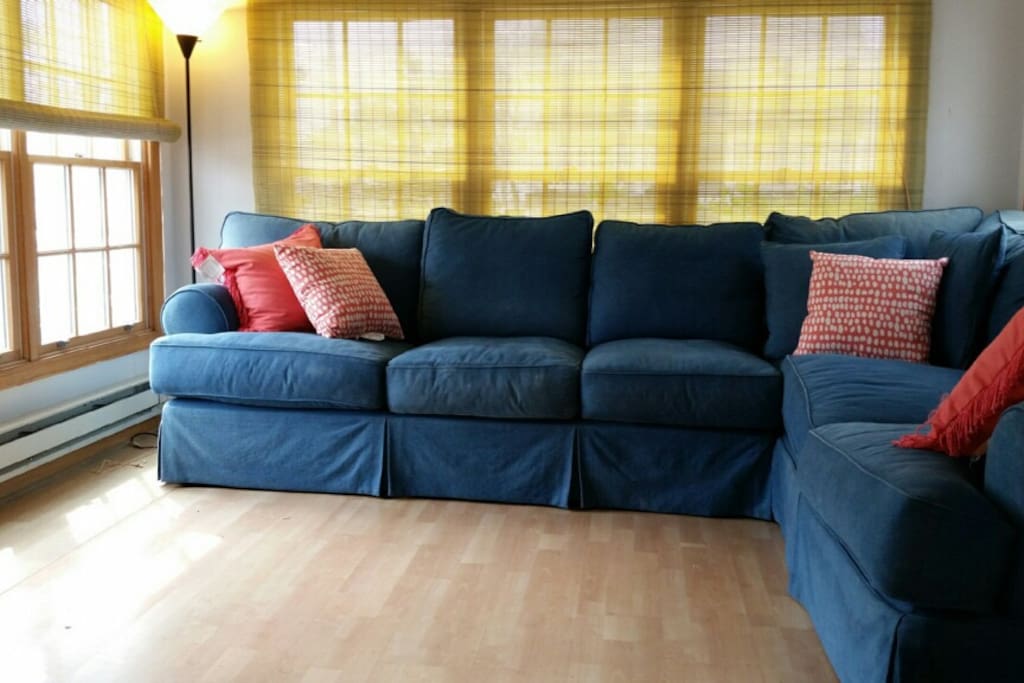 Bright and airy with windows on three sides, the "TV" room also provides additional sleeping for guests