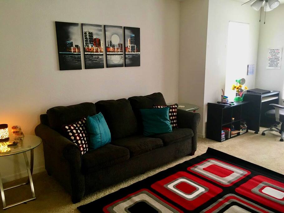 Main room with sofa that pulls out into another queen sized bed, Laptop-friendly work space