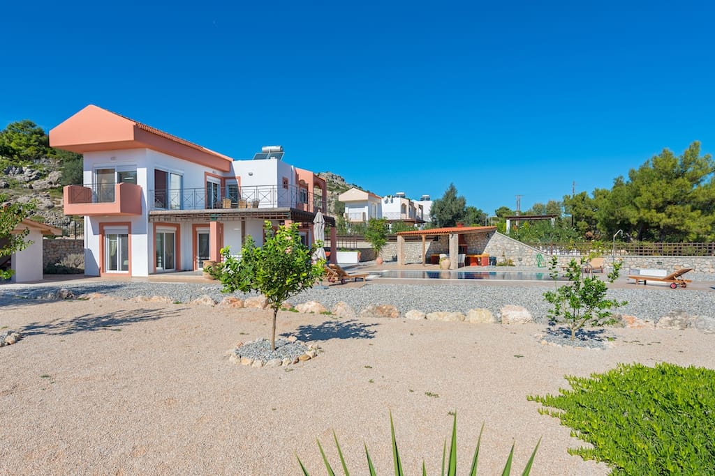 Open garden with citrus trees and mediteranean plants.