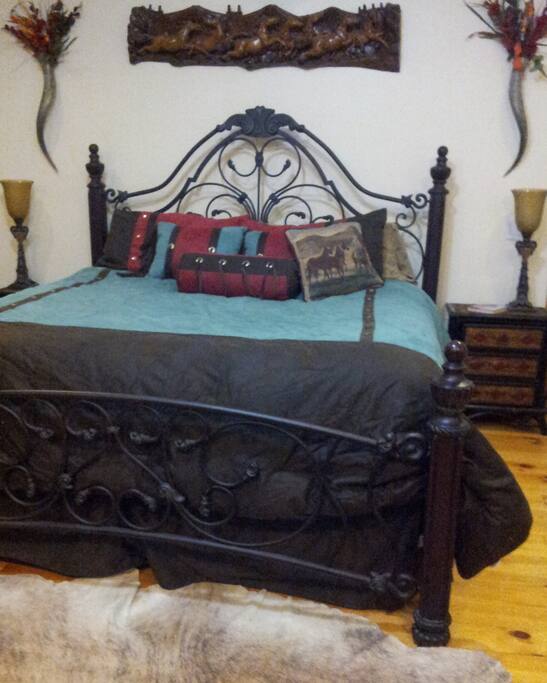 Master Bedroom fireplace and en suite with big screen TV, plus sleeper sofa