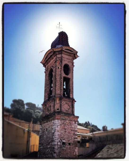 Our balcony faces directly the roof and the bell tower of a baroque style church built in 17th century. Behind the bell tower is we have the view of the famous Castle Hill its the waterfall!
