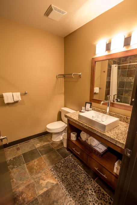 The spa inspired bathroom is spacious and elegant