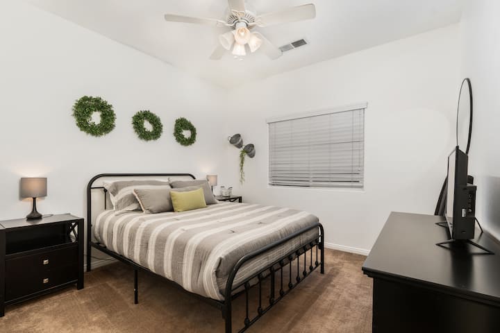 Bedroom #2.  Queen bed and tv.