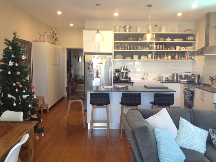 Plenty of comfortable seating in the family dining area, with a second TV.