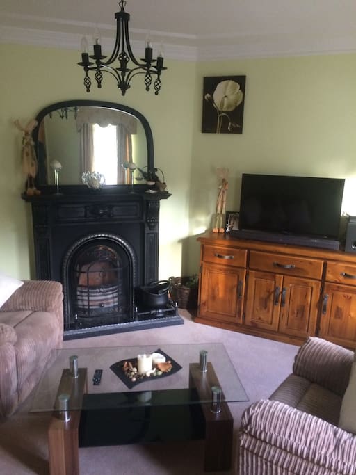 Front living room, open fire and tv