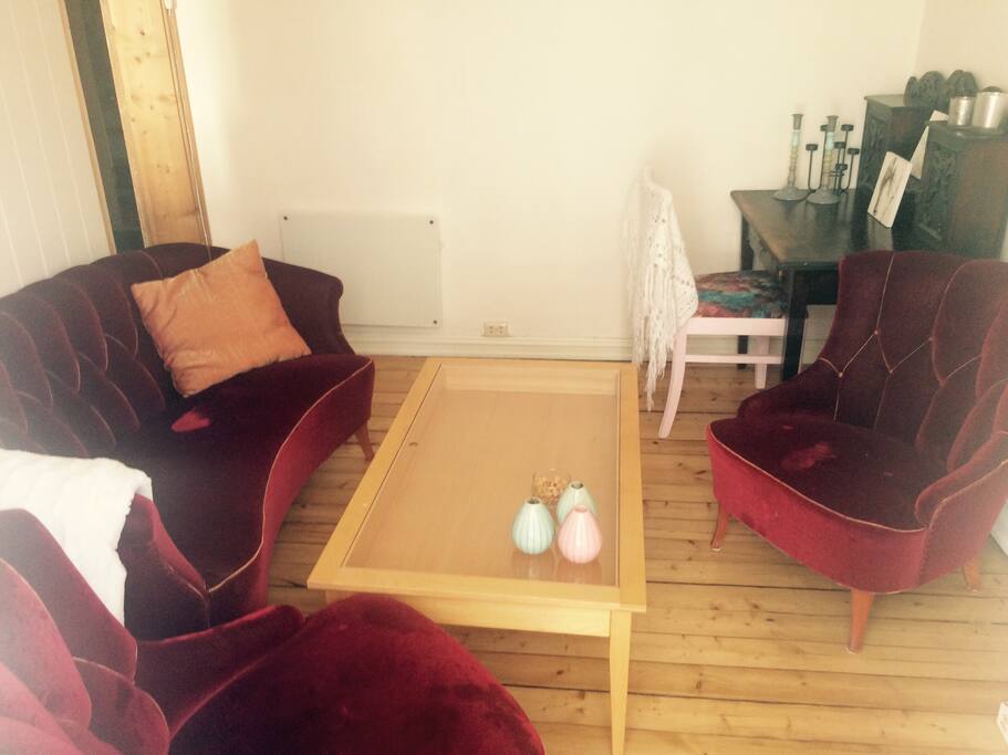 Living room with TV and access to balcony