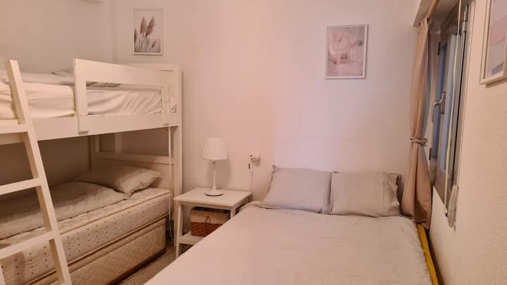 Bedroom 3: There is a bunk bed with two beds 200x90 cm and one double bed (180cmx140cm). A built-in wardrobe, a smaller dresser, and a hanger on the door are used to store things. The window faces the loggia. It has a blackout curtain.