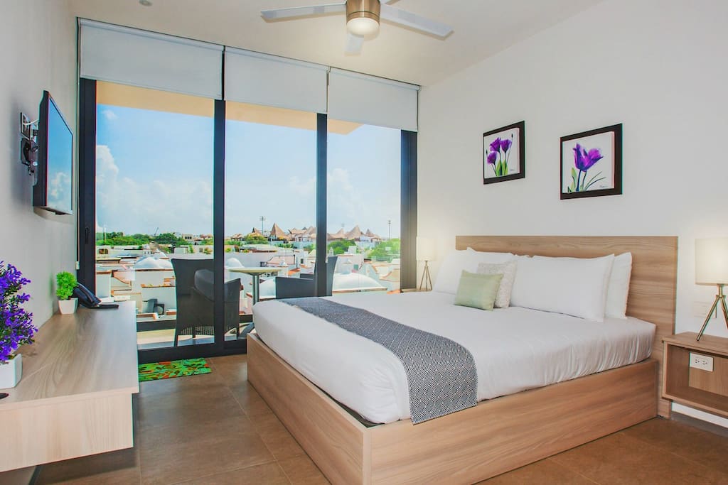 Room with view and king size bed.